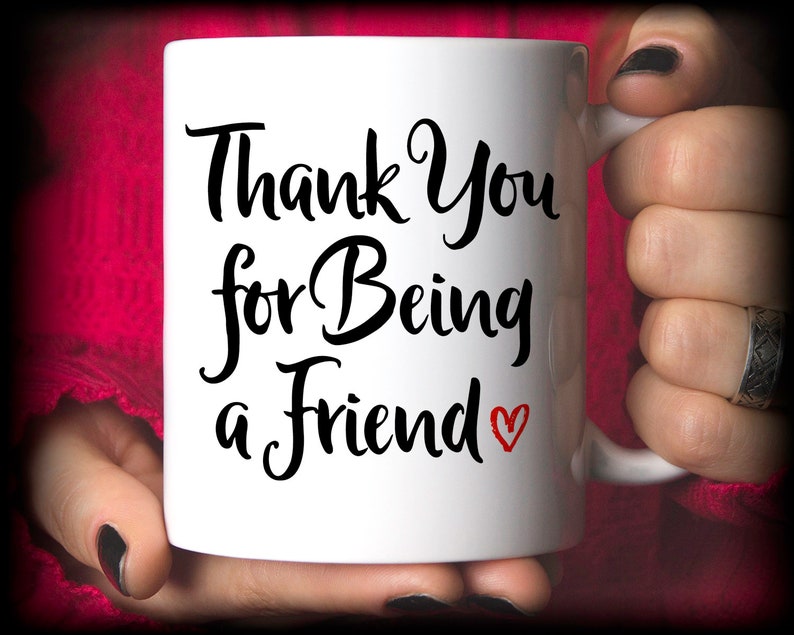 May include: White ceramic mug with black text that reads "Thank You for Being a Friend" with a small red heart.