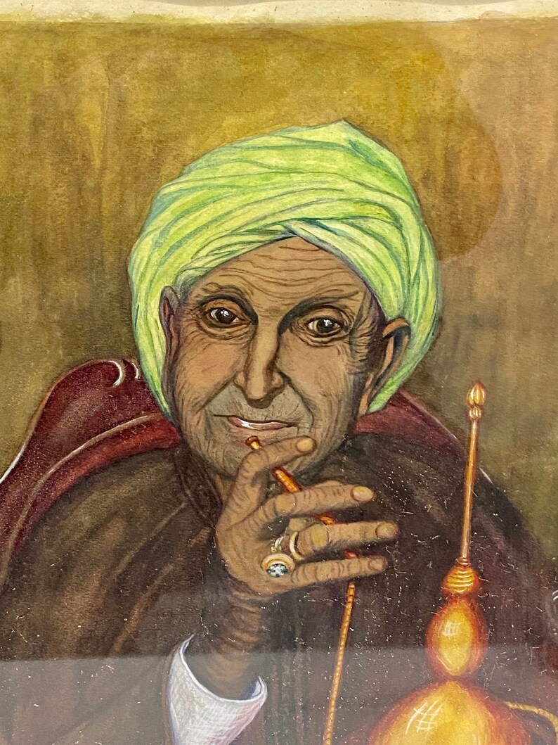May include: A painting of a man wearing a green turban, sitting in a chair and holding a pipe. He is wearing a brown robe and has a ring on his finger. The background is a brown wall.
