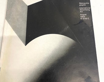 May include: A black and white magazine cover with a geometric design. The text on the cover reads "Gebrauchs-grafik International Advertising Art August 1963 B 3149 E".
