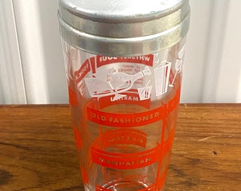 Coctelera vintage de mediados de siglo con recetas