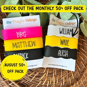 May include: A collection of silicone wristbands in neon pink, yellow, and black, featuring custom names like BRG, MATTHEW, PATRICK, WILLIAM, WADE, and ALICIA. The bands are displayed on white cards with the text the Peachy Orange and www.thepeachyorange.com.
