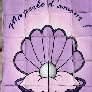 Éveil des sens : Puzzle textile - Coquillage, perle et tendre message