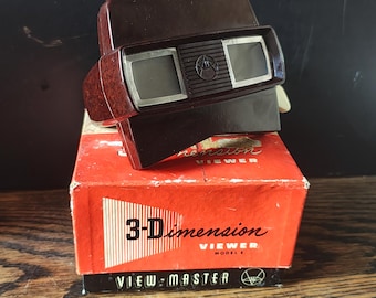 Visor 3D View-Master modelo E vintage - Baquelita marrón (década de 1950) con 15 carretes y catálogo de 1958