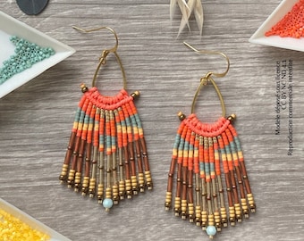 May include: A pair of handmade earrings with a fringe design. The earrings are made with brown, orange, and blue beads and have a gold hoop.