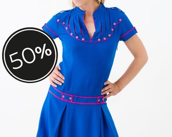 Majorette dress with pleated skirt and buttons, cool feel fabric.