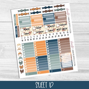 May include: A sheet of planner stickers with an autumn theme. The stickers feature various designs, including bows, hearts, leaves, and a calendar grid. The colours are orange, brown, blue, and white.