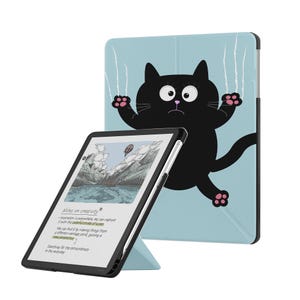 May include: A light blue tablet case featuring a cartoon black cat with wide eyes and pink paw pads, shown with a tablet displaying a mountain landscape illustration and the text Notes on creativity, inspiration is everywhere, and new perspective.