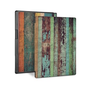 May include: A colorful wood grain pattern with a distressed look. The pattern is made up of vertical stripes of various shades of blue, green, brown, orange, and yellow. The wood is weathered and has a rustic appearance.