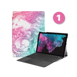 May include: A black laptop with a keyboard and a colourful abstract design on the case. The laptop is open and the screen is displaying a colourful image.