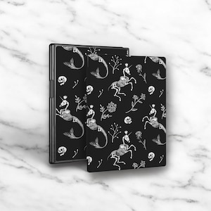 May include: Two black covers with a white skeletal unicorn and seahorse pattern. The pattern includes skulls and floral elements.