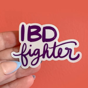 May include: White sticker with the text "IBD fighter" in purple lettering.