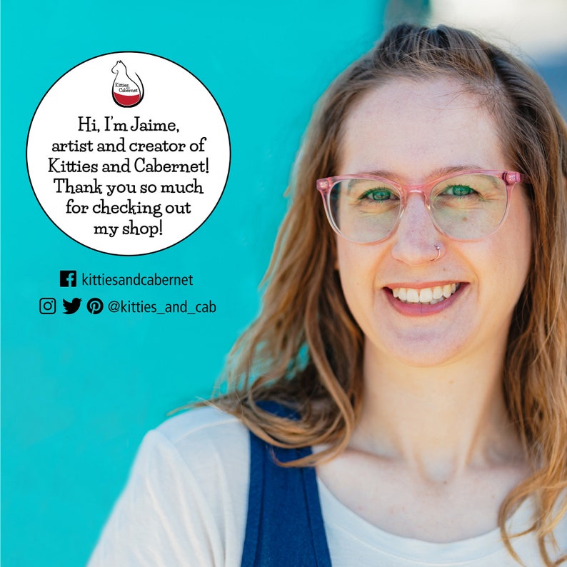 May include: A woman with pink glasses and a nose ring smiles at the camera. She is wearing a blue and white shirt. The background is a bright turquoise blue. A white circle with text reads "Hi, I'm Jaime, artist and creator of Kitties and Cabernet! Thank you so much for checking out my shop!" with social media links below.