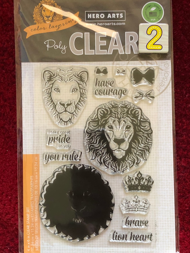 May include: A set of 4x6 inch clear stamps featuring lion illustrations and inspirational phrases like "have courage", "I take great pride in you", "you rule!" and "brave lion heart".