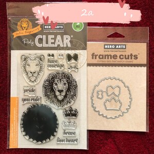 May include: A set of clear polymer stamps and metal cutting dies featuring a lion theme. The stamps include images of a lion's head, a crown, and the words "have courage", "take great pride in you", "you rule", and "brave lion heart". The dies include a circle with a crown and two bows inside.