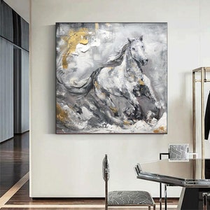 May include: Abstract painting of a white horse running through a grey and gold landscape. The horse is painted in a realistic style, with details of its mane and tail. The background is a mix of grey, white, and gold, creating a sense of movement and energy.