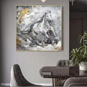 May include: Abstract painting of a white horse running through a grey and gold landscape. The horse is painted in a loose, expressive style with visible brushstrokes. The background is a mix of grey, white, and gold, with hints of black.