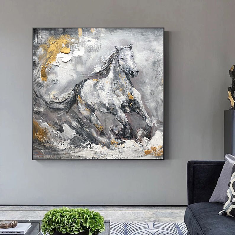 May include: Abstract painting of a white horse running through a grey and gold landscape. The horse is painted in a realistic style with a textured brushstroke. The background is a mix of grey, white, and gold.
