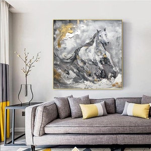 May include: Abstract painting of a white horse running through a grey and gold landscape. The horse is painted in a realistic style, with details of its mane and tail. The background is a mix of grey, white, and gold, with hints of texture.
