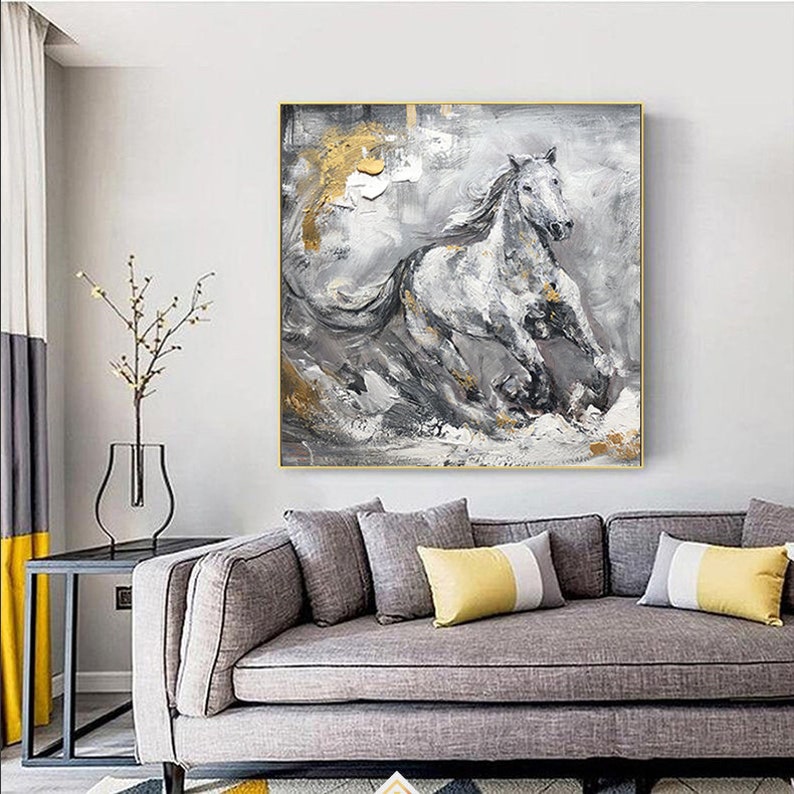 May include: Abstract painting of a white horse running through a grey and gold landscape. The horse is painted in a realistic style, with details of its mane and tail. The background is a mix of grey, white, and gold, with hints of texture.
