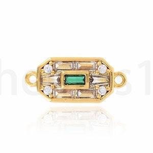 May include: Gold-toned connector with a green rectangular stone and clear stones in a geometric design. The connector has two loops on either side.