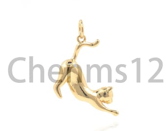 May include: A gold-colored pendant charm in the shape of a cat. The cat is arched backwards with its tail raised in the air. The charm is designed to be worn on a necklace or bracelet.