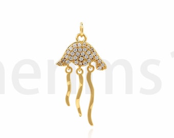 May include: Gold-toned pendant featuring a clear crystal-encrusted jellyfish design with four dangling tentacles.