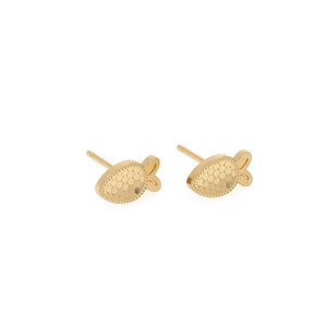 May include: A pair of gold fish-shaped stud earrings. The fish have a textured surface and a small tail.