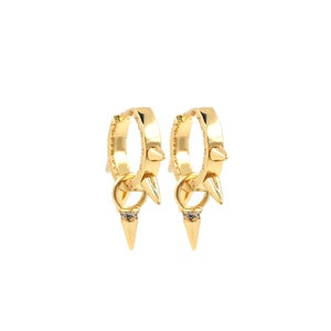 May include: Gold hoop earrings with a small spike charm and a clear rhinestone. The earrings have a punk rock aesthetic.