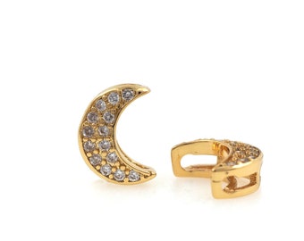 Puede incluir: Un par de conectores de encanto de media luna de tono dorado con acentos de cristal transparente. Los encantos están diseñados para ser utilizados como conectores para la elaboración de joyas.