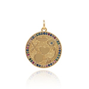 May include: Gold pendant necklace with a round charm featuring a heart, an arrow, an 'X' and a circle with a small heart inside. The charm is surrounded by a border of colorful gemstones.