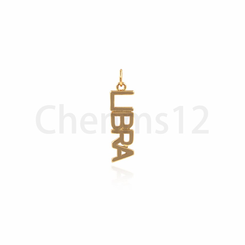 May include: Gold-colored pendant charm with the word "LIBRA" spelled vertically.