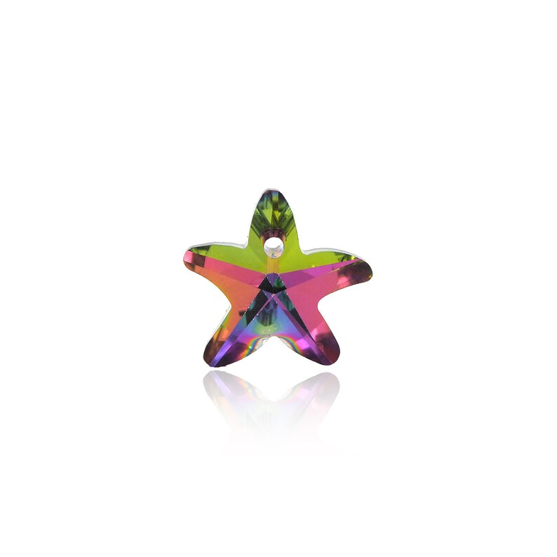 May include: A small, iridescent, crystal starfish charm with a hole for hanging. The charm is a light green, pink, and purple color.