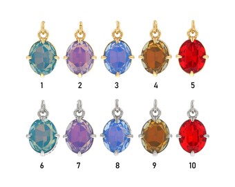 May include: Ten oval-shaped glass charms with gold or silver settings. The charms are in various colors, including blue, purple, red, and brown.