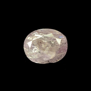 May include: A pale pink oval-shaped gemstone with a faceted cut. The gemstone has a translucent appearance with a slight shimmer.