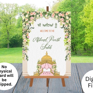 May include: A printable wedding sign with a floral border and a gold and pink illustration of a traditional Indian wedding canopy. The sign reads "Welcome to the Akhand Paath Sahib".