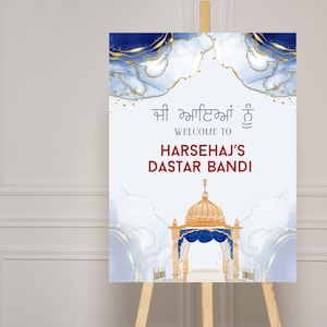 May include: A welcome sign for a "Dastar Bandi" celebration, featuring a blue and gold watercolor background with a golden temple silhouette. The sign reads "Welcome to Harsehaj's Dastar Bandi" in English and Punjabi.