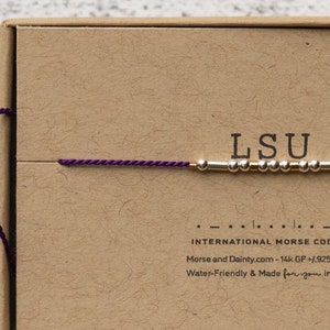 LSU Bracelet or Any College in Morse Code. Purple cord or choose from 20 colors. Silver and Gold Filled for Everyday Wear. Adjustable