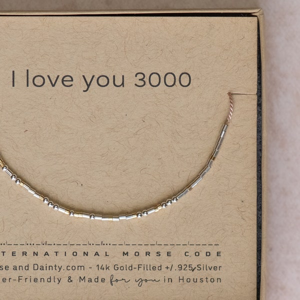 I love you 3000 Morse Code Gift Bracelet. Any size and many color options. Cord can hang or be held up. Water friendly on durable silk cord