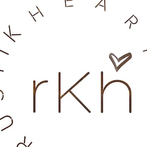 May include: A brown wooden sign with the word "remarkable" written in white letters. The sign is surrounded by a circle of letters that spell out "rustic heart art".
