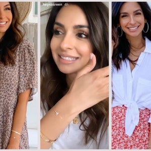 May include: A collection of jewelry including thin gold bracelets, a delicate chain bracelet with a single small stone, and a gold pendant necklace featuring the letter N. The accessories are shown alongside various outfits including a leopard print dress.