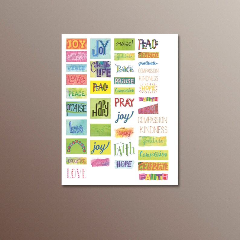 May include: A colourful printable wall art design with words such as "joy", "peace", "love", "faith", "hope", "pray", "celebrate", "gratitude", "compassion", and "kindness" in a variety of fonts and colours.