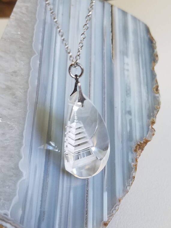 Pagoda Etched Into Blue Gemstone Necklace