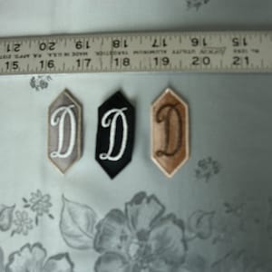 EMBROIDERED MONOGRAMMED INITIAL – D