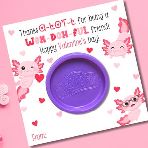 May include: A white card with pink hearts and axolotl illustrations. The card says "Thanks a lot for being a won-doh-ful friend! Happy Valentine's Day!" and includes a small container of Play-Doh.