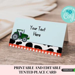 May include: Printable tented place card with a green tractor on a blue background with a black and white cow print border and red and white gingham border. The text "Your Text Here" is on the card.