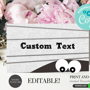 May include: Editable printable Halloween place card with a white woodgrain background and a black monster peeking out from behind the wood with two white eyes. The text "Custom Text" is printed in black on the woodgrain background. The text "Tented Placecard" is printed in black on a gray circle. The text "Editable!" is printed in black. The text "Print and Cut" is printed in black. The text "Instant Download" is printed in black. The text "Download" is printed in black.