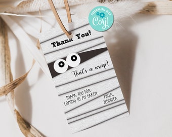 May include: A white thank you tag with a black and white mummy design. The tag says "Thank You! That's a wrap! Thank you for coming to my party! From, Jennifer".