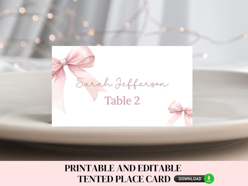 May include: Printable pink and white place card with a pink bow and the text "Sarah Jefferson Table 2".