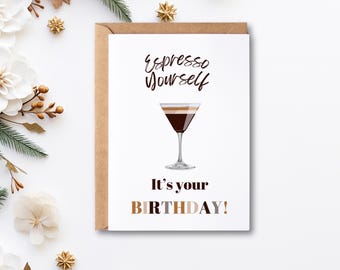 May include: A white card with brown text that reads "Espresso Yourself" and a drawing of a coffee drink in a martini glass. Below the drawing is the text "It's your BIRTHDAY!" in brown, gray, and orange text.
