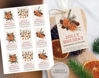May include: A collection of holiday-themed simmering potpourri tags and a bag of potpourri. The tags feature illustrations of dried orange slices, pinecones, and greenery with the text "JOLLY HOLIDAY SIMMERING POTPOURRI". The bag includes dried oranges and pinecones.
